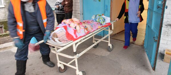 Lucrători la o morgă, imagine din arhivă - Sputnik Moldova