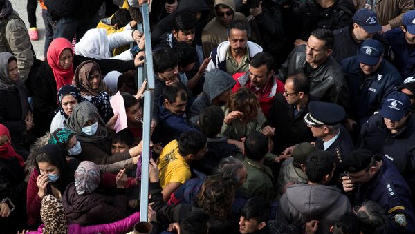 Refugees and migrants, most of them Afghans, block the entrance of the refugee camp at the disused Hellenikon airport as police officers try to disperse them, in Athens, Greece, February 6, 2017 - Sputnik Moldova-România