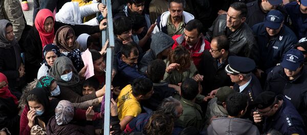 Refugees and migrants, most of them Afghans, block the entrance of the refugee camp at the disused Hellenikon airport as police officers try to disperse them, in Athens, Greece, February 6, 2017 - Sputnik Moldova-România