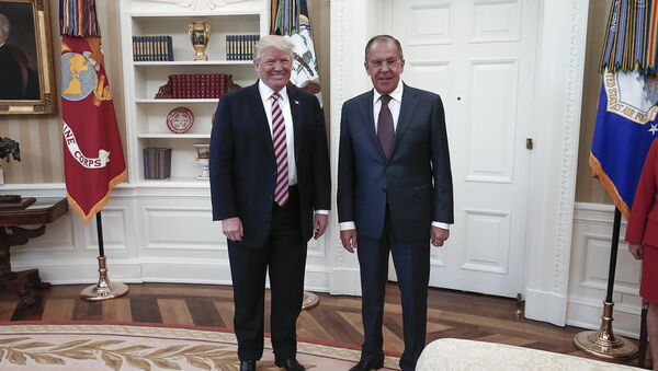 A handout photo made available by the Russian Foreign Ministry on May 10, 2017 shows US President Donald J. Trump (L) posing with Russian Foreign Minister Sergei Lavrov during a meeting at the White House in Washington, DC. - Sputnik Moldova-România