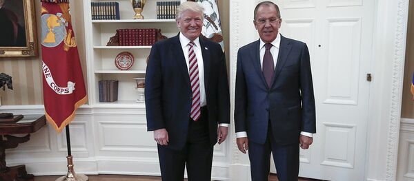 A handout photo made available by the Russian Foreign Ministry on May 10, 2017 shows US President Donald J. Trump (L) posing with Russian Foreign Minister Sergei Lavrov during a meeting at the White House in Washington, DC. - Sputnik Moldova
