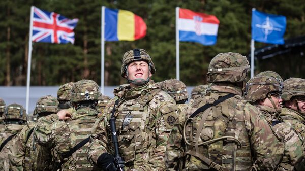US soldiers are pictured prior the beginning of the official welcoming ceremony of NATO troops in Orzysz, Poland, on April 13, 2017. - Sputnik Moldova-România