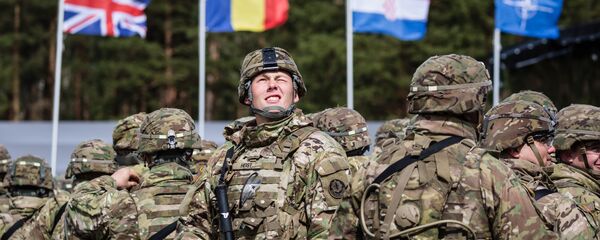 US soldiers are pictured prior the beginning of the official welcoming ceremony of NATO troops in Orzysz, Poland, on April 13, 2017. - Sputnik Moldova-România