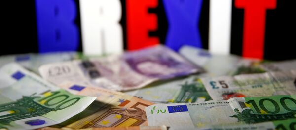 Euro and pound banknotes are seen in front of BREXIT letters in this picture illustration taken April 28, 2017. - Sputnik Молдова