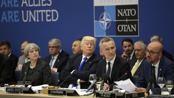 British Prime Minister Theresa May, U.S. President Donald Trump and NATO Secretary General Jens Stoltenberg listen to Belgian Prime Minister Charles Michel as he speaks during a working dinner meeting at the NATO headquarters during a NATO summit of heads of state and government in Brussels on Thursday, May 25, 2017 - Sputnik Moldova-România