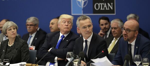 British Prime Minister Theresa May, U.S. President Donald Trump and NATO Secretary General Jens Stoltenberg listen to Belgian Prime Minister Charles Michel as he speaks during a working dinner meeting at the NATO headquarters during a NATO summit of heads of state and government in Brussels on Thursday, May 25, 2017 - Sputnik Moldova-România