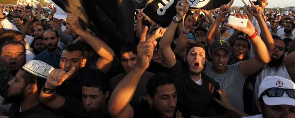 In this Friday, Sept. 21, 2012 file photo, Libyan followers of Ansar al-Shariah Brigades and other Islamic militias, hold a demonstration against a film and a cartoon denigrating the Prophet Muhammad in Benghazi - Sputnik Moldova-România