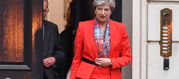 British Prime Minister Theresa May leaves the Conservative Party HQ in central London, on June 9, 2017, hours after the polls closed in the British general election. - Sputnik Moldova