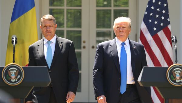 President Donald Trump, accompanied by Romanian President Klaus Werner Iohannis, walk to the dais to begin a news conference in the Rose Garden at the White House, Friday, June 9, 2017, in Washington. - Sputnik Moldova