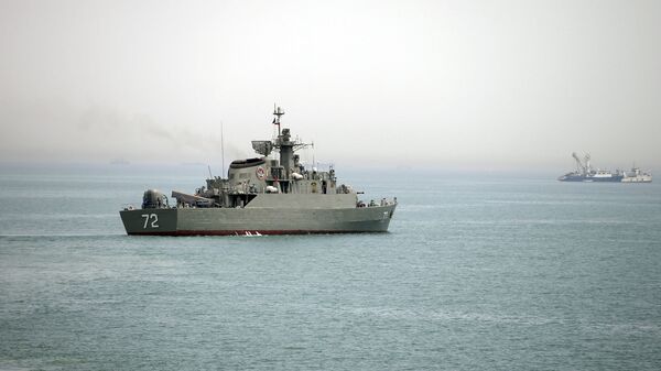 In this Tuesday, April 7, 2015, file photo released by the semi-official Fars News Agency, Iranian warship Alborz, foreground, prepares before leaving Iran's waters, at the Strait of Hormuz - Sputnik Moldova-România