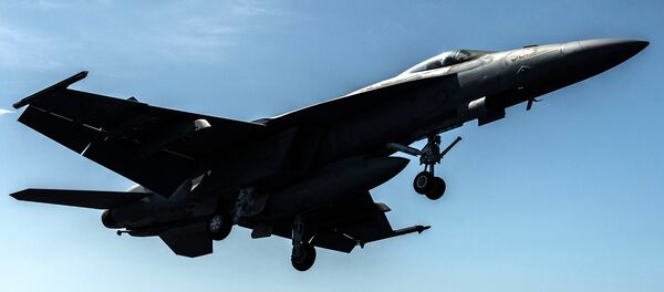 An F/A-18F Super Hornet, assigned to the “Sidewinders” of Strike Fighter Squadron (VFA) 86, takes flight from the flight deck of the aircraft carrier USS Ronald Reagan - Sputnik Moldova-România