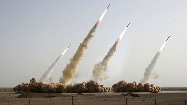 A handout picture released on the news website and public relations arm of Iran's Revolutionary Guards, Sepah News, shows an image apparently digitally altered to show four missiles rising into the air instead of three during a test-firing at an undisclosed location in the Iranian desert (File) - Sputnik Moldova-România