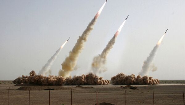 A handout picture released on the news website and public relations arm of Iran's Revolutionary Guards, Sepah News, shows an image apparently digitally altered to show four missiles rising into the air instead of three during a test-firing at an undisclosed location in the Iranian desert (File) - Sputnik Moldova-România
