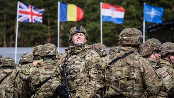 US soldiers are pictured prior the beginning of the official welcoming ceremony of NATO troops in Orzysz, Poland, on April 13, 2017. - Sputnik Moldova-România