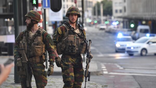 In this image taken from video, police cars create a cordon near the train station in central Brussels, Tuesday June 20, 2017. Belgian media report that explosion-like noises have been heard at a Brussels train station; the main square evacuated. - Sputnik Moldova-România
