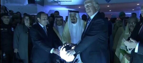 U.S. President Donald Trump places his hands on a glowing orb as he tours with other leaders the Global Center for Combatting Extremist Ideology in Riyadh, Saudi Arabia May 21, 2017 - Sputnik Moldova-România