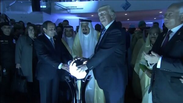 U.S. President Donald Trump places his hands on a glowing orb as he tours with other leaders the Global Center for Combatting Extremist Ideology in Riyadh, Saudi Arabia May 21, 2017 - Sputnik Moldova-România
