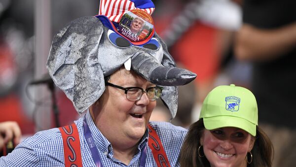 A Donald Trump supporter wears an elephant-shaped hat during the opening day of the Republican National Convention in Cleveland, Monday, July 18, 2016 - Sputnik Moldova