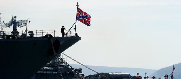 The Russian Navy flagship missile cruiser 'Moskva' (L) remains docked in the bay of the Crimean city of Sevastopolon March 30, 2014 - Sputnik Moldova-România