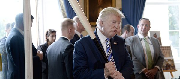 US President Donald Trump examines US-made products from all 50 states, including a Marucci baseball bat, in the Blue Room of the White House during a Made in America product showcase event in Washington, DC, on July 17, 2017. - Sputnik Moldova-România