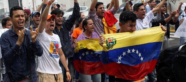Opposition supporters shout slogans during a protest against Venezuelan President Nicolas Maduro's government in San Cristobal, Venezuela March 31, 2017 Opposition supporters shout slogans during a protest against Venezuelan President Nicolas Maduro's government in San Cristobal, Venezuela March 31, 2017 - Sputnik Moldova-România