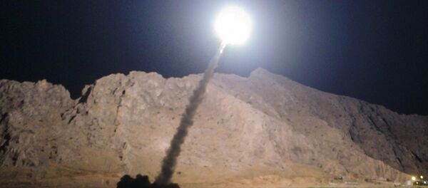 In this picture released by the Iranian state-run IRIB News Agency on Monday, June 19, 2017, a missile is fired from city of Kermanshah in western Iran targeting the Islamic State group in Syria - Sputnik Moldova-România