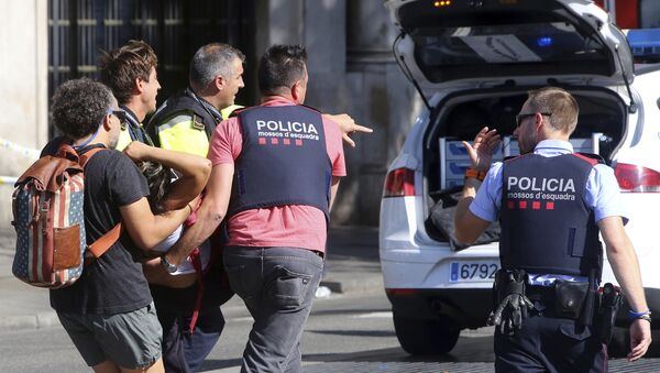 An injured person is carried in Barcelona, Spain, Thursday, Aug. 17, 2017, after a white van jumped the sidewalk in the historic Las Ramblas district, crashing into a summer crowd of residents and tourists and injuring several people, police said - Sputnik Moldova-România