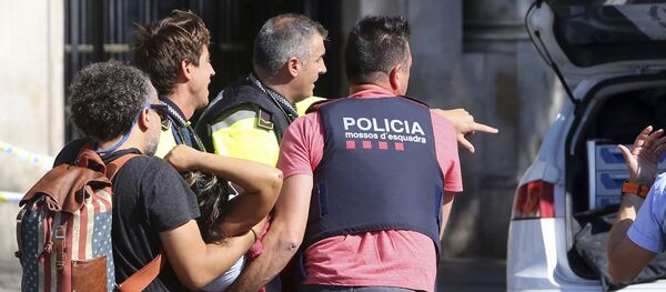 An injured person is carried in Barcelona, Spain, Thursday, Aug. 17, 2017, after a white van jumped the sidewalk in the historic Las Ramblas district, crashing into a summer crowd of residents and tourists and injuring several people, police said - Sputnik Moldova