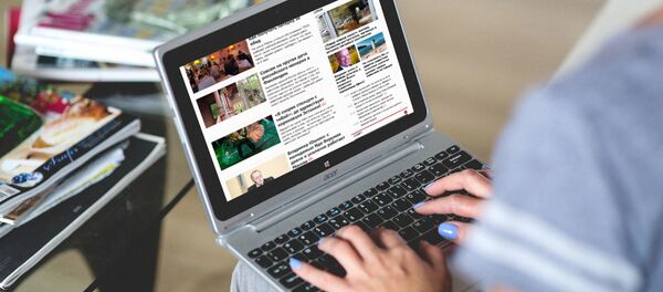 Новостной сайт на экране ноутбука - Sputnik Moldova