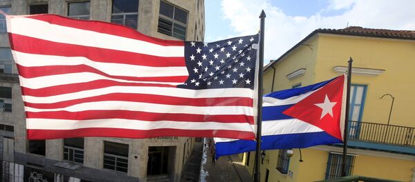 US and Cuban flags are seen on the balcony of a restaurant in downtown Havana, Cuba March 19, 2016. - Sputnik Moldova-România