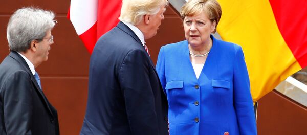Angela Merkel und Donald Trump beim G7-Gipfel in Italien - Sputnik Moldova-România
