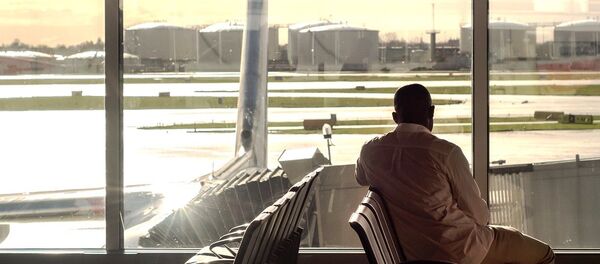 A passenger waiting for his flight A passenger waiting for his flight - Sputnik Moldova-România