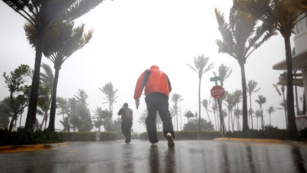 People walk along a street in South Beach as Hurricane Irma arrives at south Florida, in Miami Beach, Florida, U.S., September 10, 2017 - Sputnik Moldova