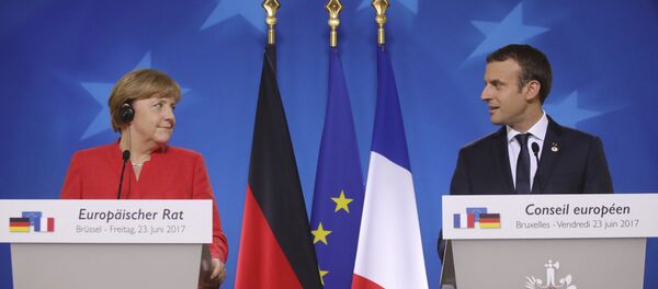 German Chancellor Angela Merkel, left, and French President Emmanuel Macron prepare to address the media at an EU summit in Brussels on Friday, June 23, 2017. German Chancellor Angela Merkel, left, and French President Emmanuel Macron prepare to address the media at an EU summit in Brussels on Friday, June 23, 2017. - Sputnik Moldova-România