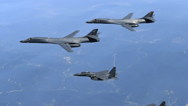 In this June 20, 2017 file photo provided by South Korean Defense Ministry, U.S. Air Force B-1B bombers, top, and second from top, and South Korean fighter jets F-15K fly over the Korean Peninsula, South Korea - Sputnik Moldova
