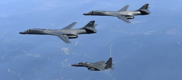 In this June 20, 2017 file photo provided by South Korean Defense Ministry, U.S. Air Force B-1B bombers, top, and second from top, and South Korean fighter jets F-15K fly over the Korean Peninsula, South Korea - Sputnik Moldova