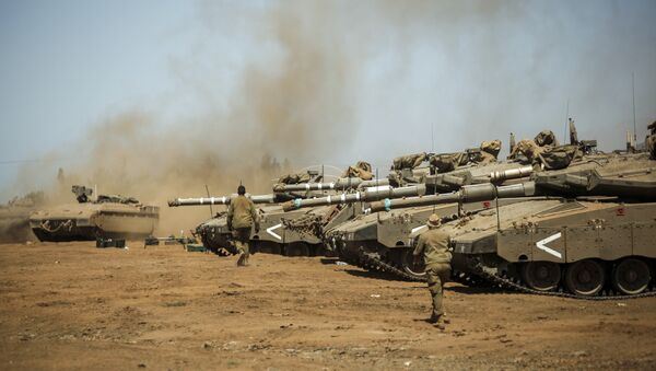 Israeli soldiers manuever Merkava tanks and Namer armored personnel carriers (APCs) during the last day of a military exercise in the northern part of the Israeli-annexed Golan Heights on September 13, 2017.  - Sputnik Moldova-România