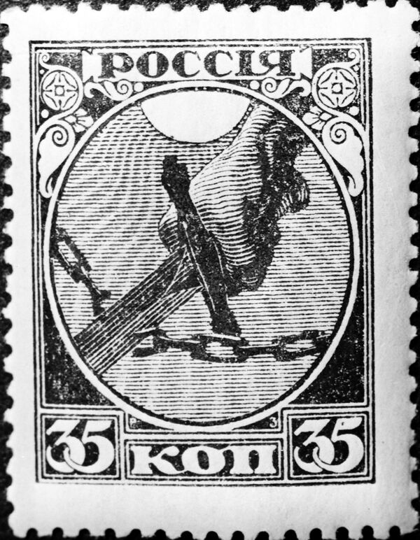 Первая революционная почтовая марка. Вышла 7.XI.1918 году в день первой годовщины Великой Октябрьской социалистической революции. Репродукция. - Sputnik Молдова