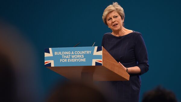 Britain's Prime Minister Theresa May delivers her speech on the final day of the Conservative Party annual conference at the Manchester Central Convention Centre in Manchester, northwest England - Sputnik Moldova-România