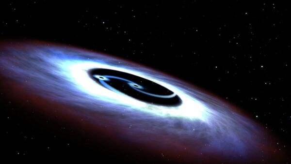 Markarian 231, a binary black hole found in the center of the nearest quasar host galaxy to Earth, is seen in a NASA illustration released August 27, 2015 - Sputnik Moldova-România