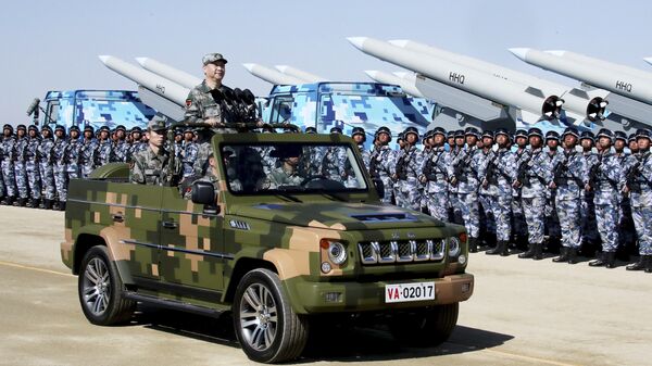 In this photo released by Xinhua News Agency, Chinese President Xi Jinping stands on a military jeep as he inspects troops of the People's Liberation Army during a military parade to commemorate the 90th anniversary of the founding of the PLA at Zhurihe training base in north China's Inner Mongolia Autonomous Region, Sunday, July 30, 2017 - Sputnik Moldova-România