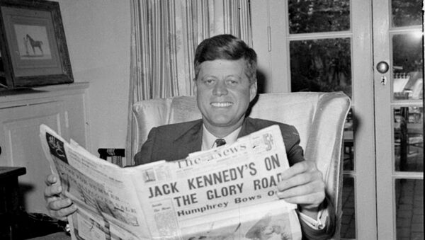 Sen. John F. Kennedy (D-MA) reads the daily newspaper accounts of his West Virginia election victory as he relaxes, May 11, 1960, in his Washington home. Kennedy defeated Sen. Hubert Humphrey (D-MN) in yesterday's presidential primary. - Sputnik Moldova-România
