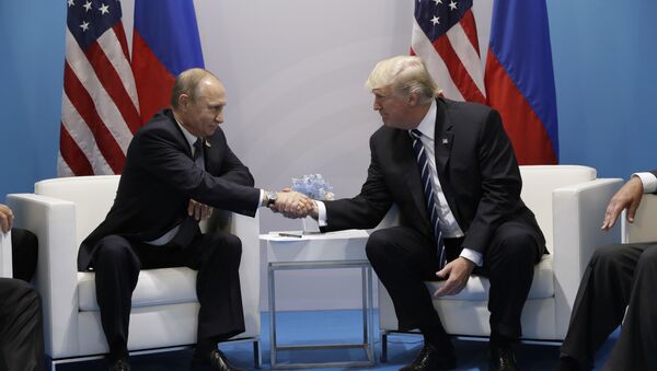 President Donald Trump shakes hands with Russian President Vladimir Putin at the G20 Summit, Friday, July 7, 2017, in Hamburg - Sputnik Moldova-România
