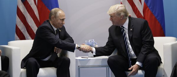 President Donald Trump shakes hands with Russian President Vladimir Putin at the G20 Summit, Friday, July 7, 2017, in Hamburg - Sputnik Moldova-România
