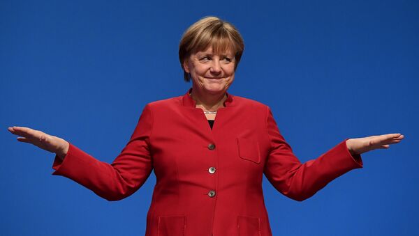 German Chancellor Angela Merkel gestures after addressing delegates during her conservative Christian Democratic Union (CDU) party's congress in Essen, western Germany, on December 6, 2016. - Sputnik Moldova-România