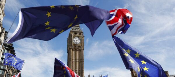 EU and Union flags fly above Parliament Square during a Unite for Europe march, in central London, Britain - Sputnik Moldova