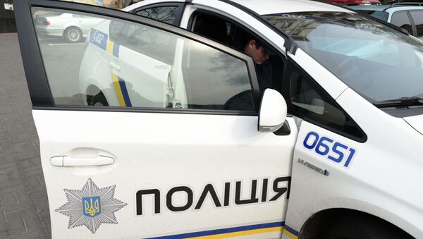 Сотрудник украинской полиции в Киеве - Sputnik Молдова