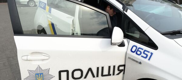 Сотрудник украинской полиции в Киеве - Sputnik Молдова