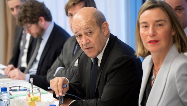 France's Foreign Minister Jean-Yves Le Drian and European Union's foreign policy chief Federica Mogherini attend a meeting with Iran's Foreign Minister Mohammad Javad Zarif, Britain's Foreign Secretary Boris Johnson and Germany's Foreign Minister Sigmar Gabriel in Brussels, Belgium - Sputnik Moldova-România
