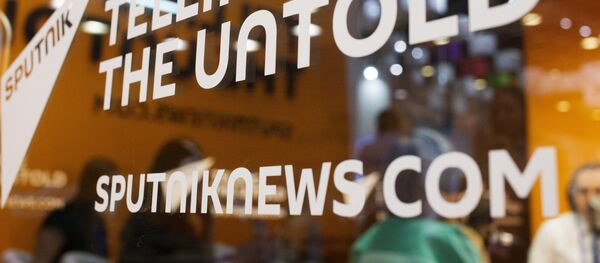 Слоган Telling the untold на студии международного информационного агентства и радио Sputnik. - Sputnik Молдова